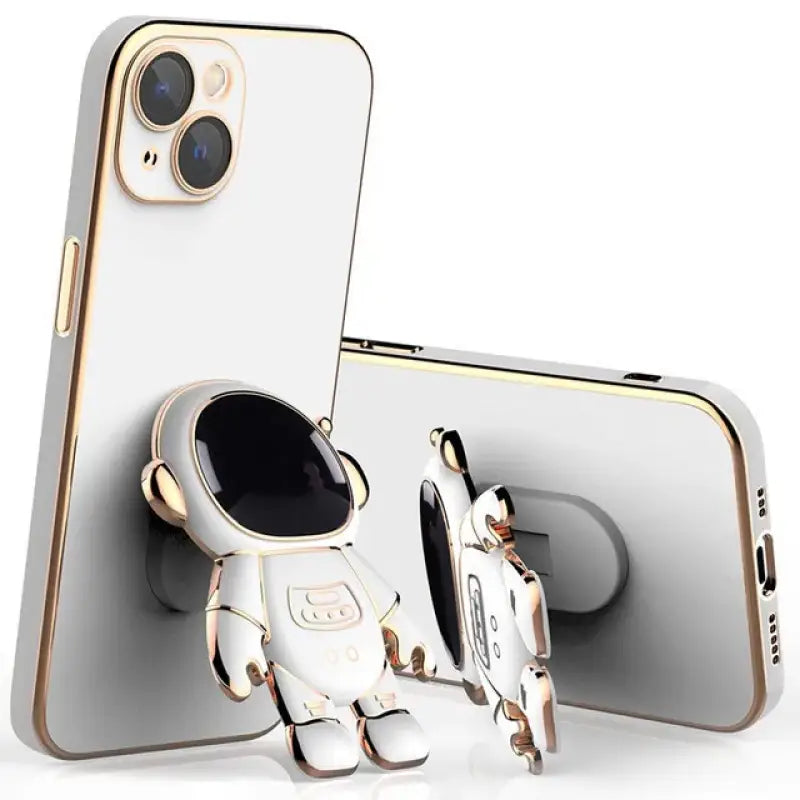 an iphone with a gold case and a white phone