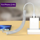an iphone charging station with a phone and a charger