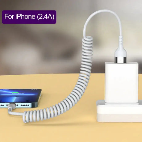 An iphone charging station with a phone and a charger