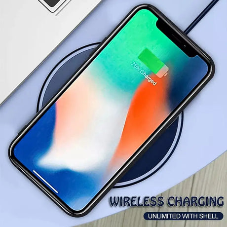 An iphone with a wireless charger on top of it