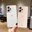 two iphones with heart - shaped faces
