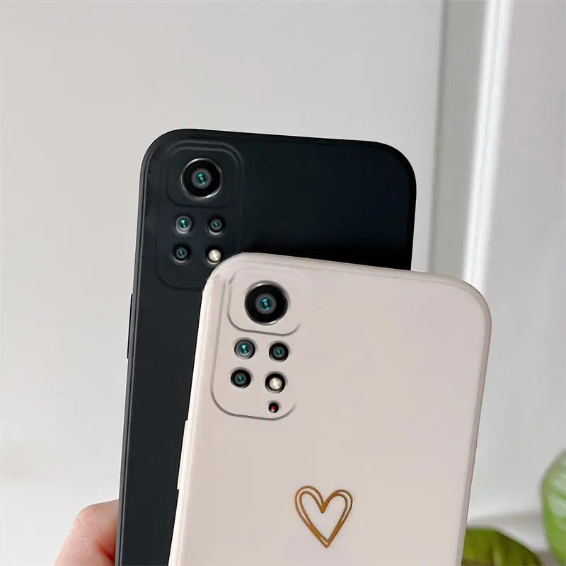 two iphones with a heart on the back