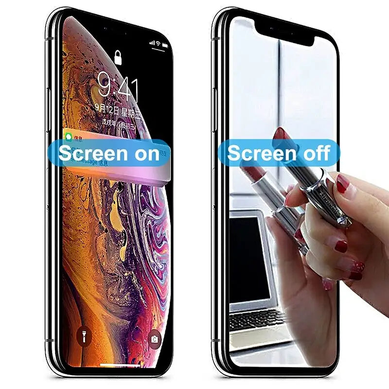 two iphones with screen off and a hand holding a pen