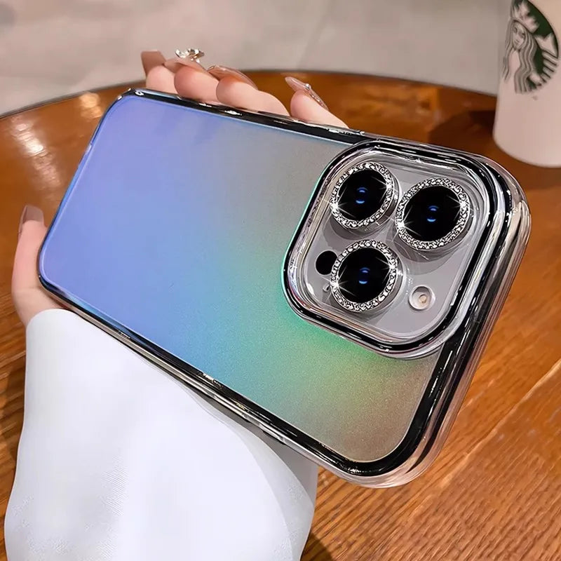 Iridescent phone case with jeweled camera lenses.