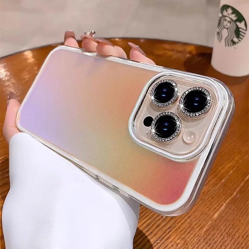 Iridescent phone case with jeweled camera lenses.