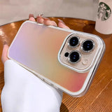 Iridescent phone case with jeweled camera lenses.