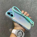 Iridescent phone case with mint green accents and wrist strap.