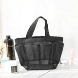 a black mesh tote bag with a black handle