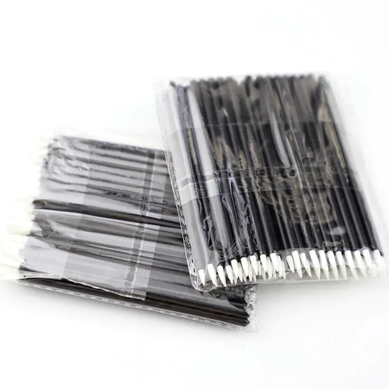 a pack of black and white plastic straws
