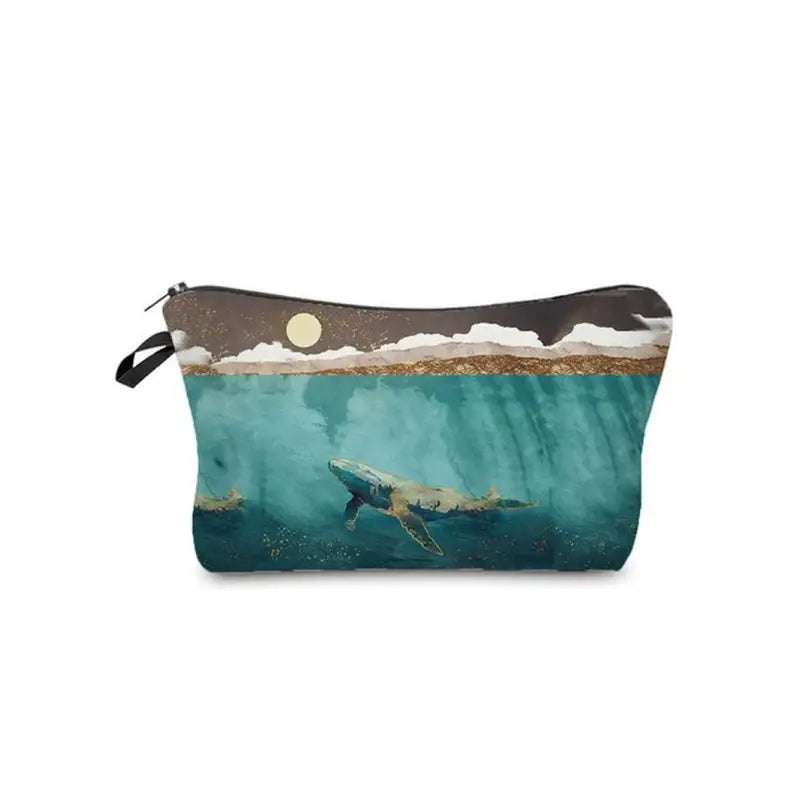 a large cosmetic bag with a shark swimming in the ocean