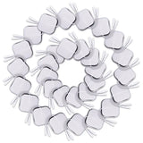 a circle of white plastic heart shaped forks