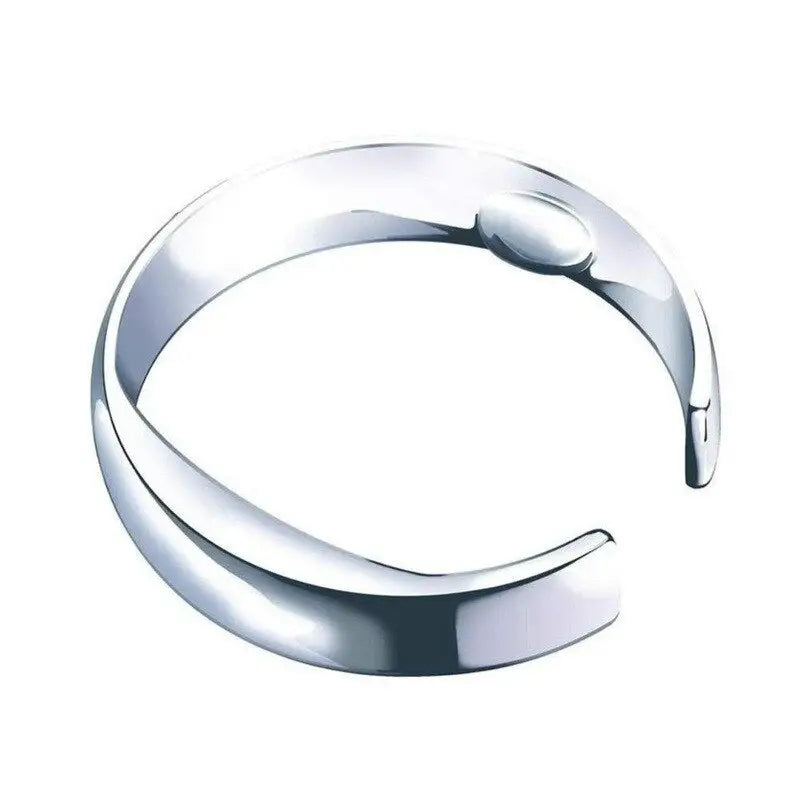 a silver bracelet with a curved design