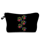 a black cosmetic bag with colorful skulls on it