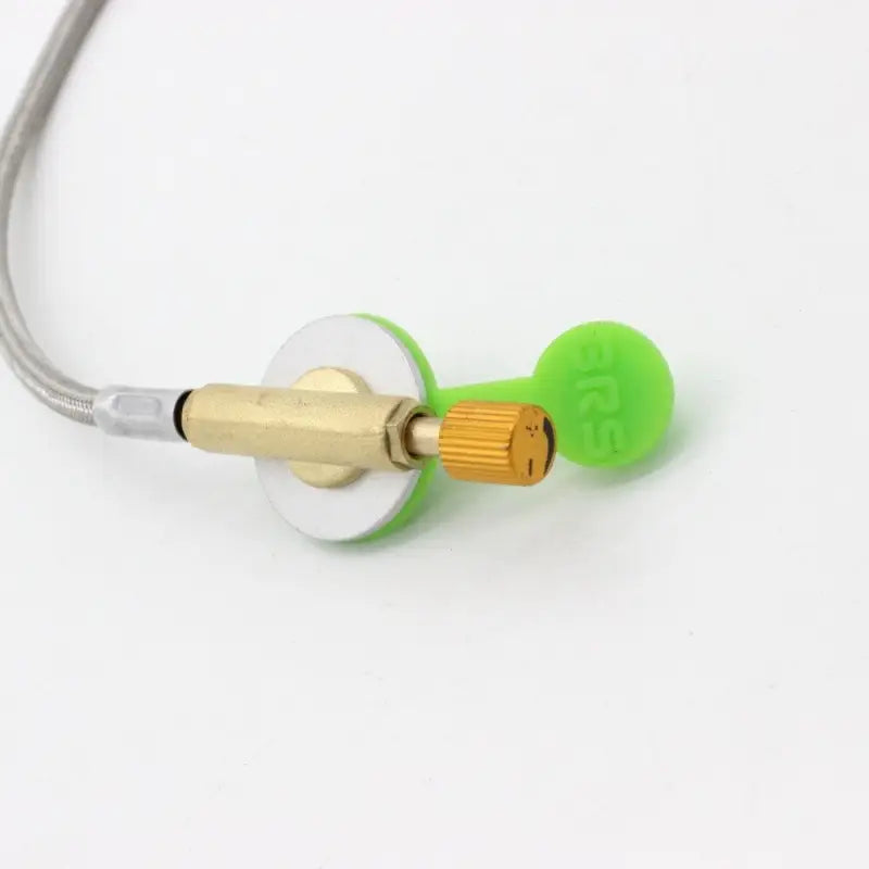 a green earphone with a gold connector