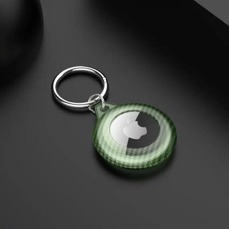 a green keychai with a white circle on it