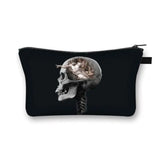 a black zipper bag with a cat and a skull on it