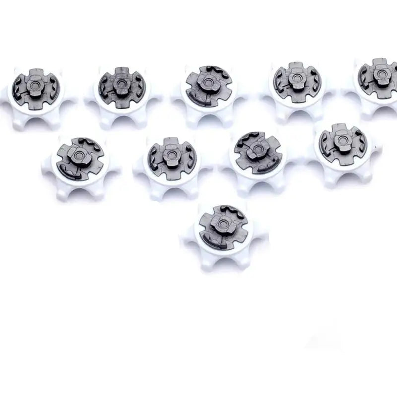 a set of white plastic screws on a white background