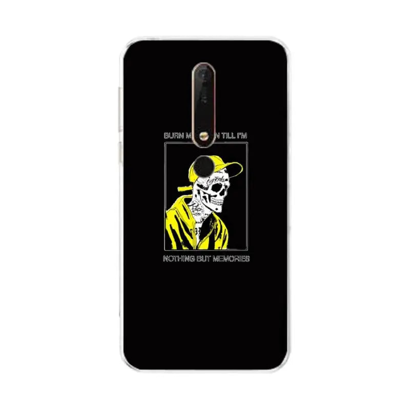 a black phone case with a yellow skull and a black background
