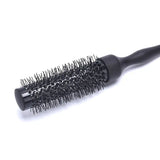 a black brush with a black handle