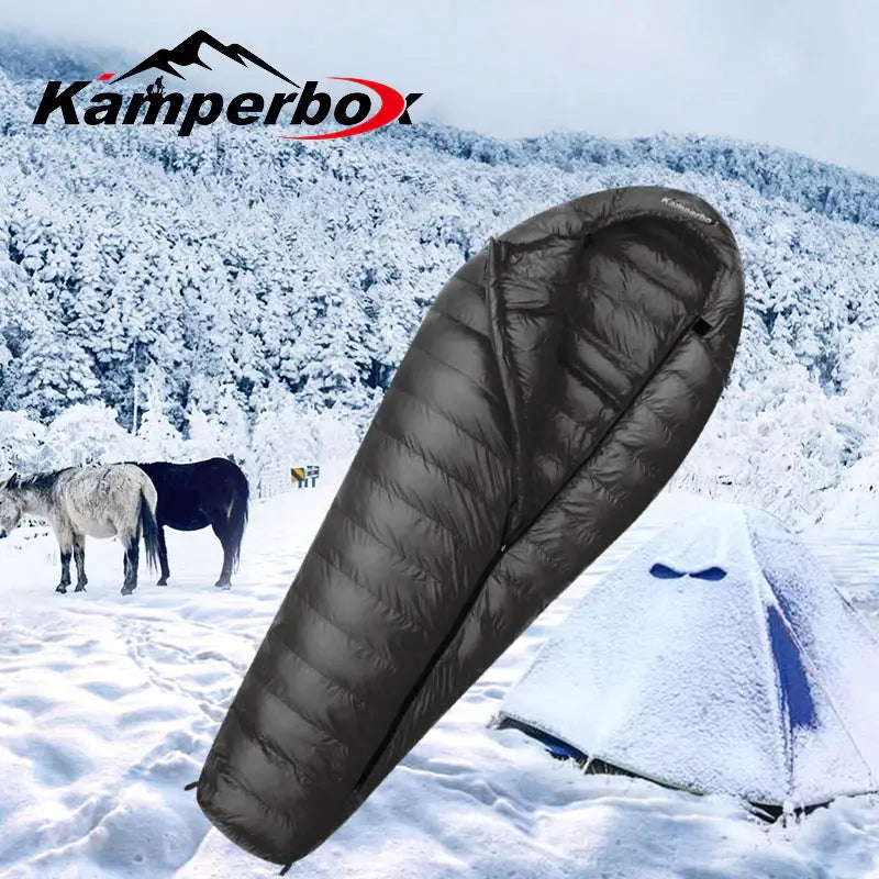 a sleeping bag in the snow with horses in the background