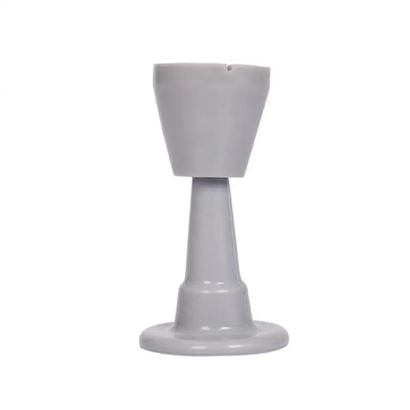 a white candle holder with a small candle on top