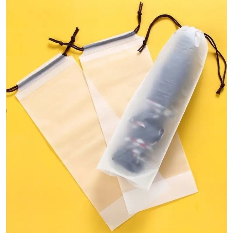 a roll of clear plastic film on a yellow background