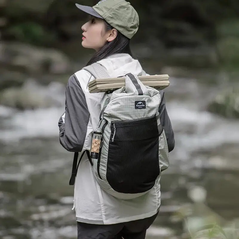 a woman standing in front of a river