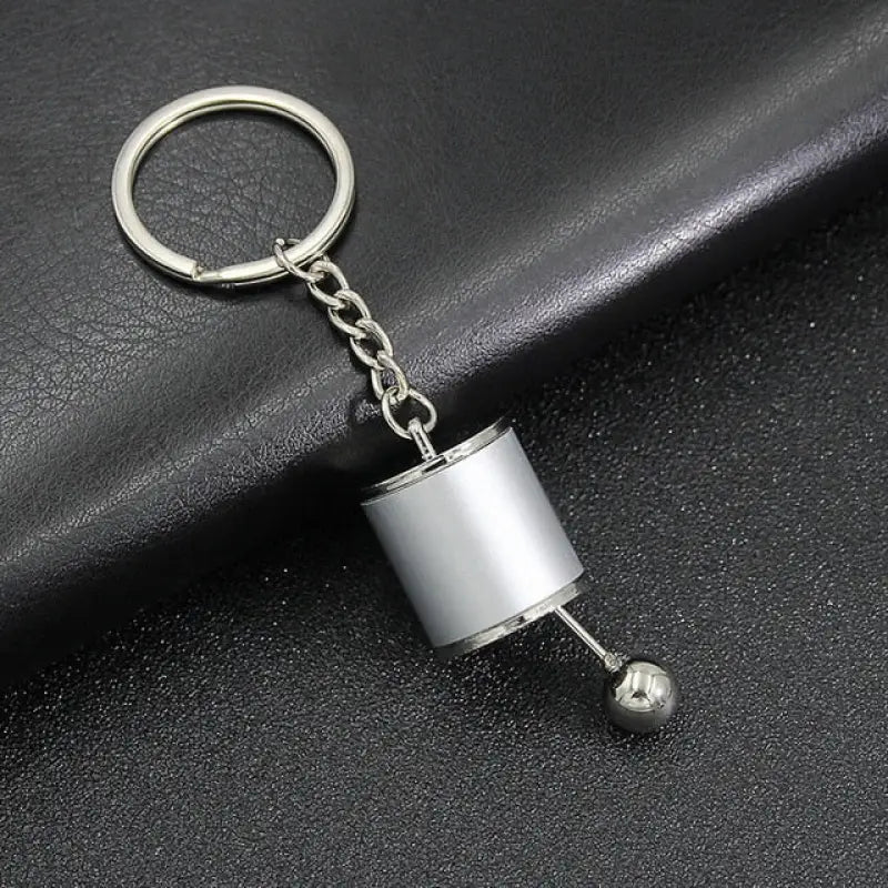 a metal keychai with a metal ball on it