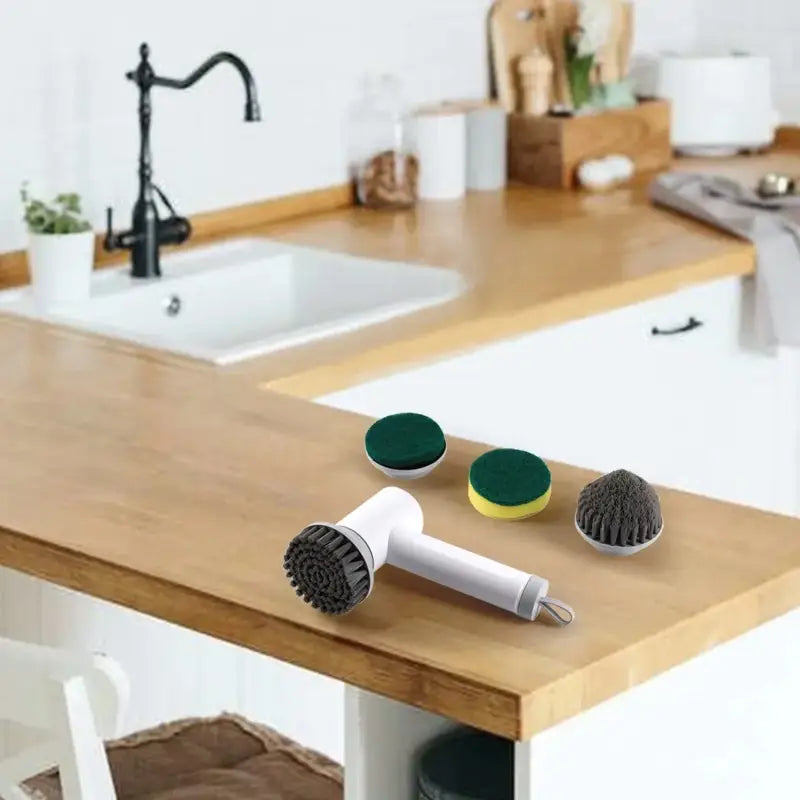 a kitchen sink with a brush and sponge on it