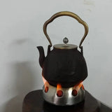 a kettle with a tea kettle on top of it