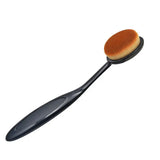 a black oval brush with a wooden handle