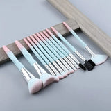 a set of pink and blue cutlers with a wooden frame