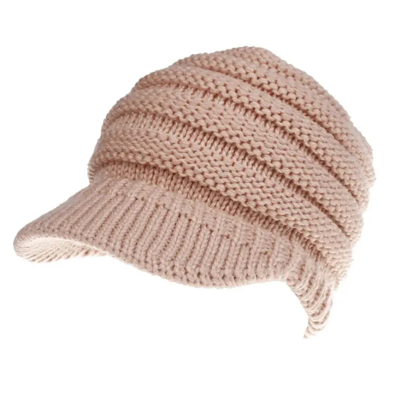 a beige knitted hat with a knot on the br