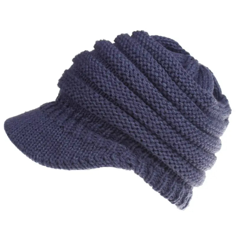a navy blue knitted hat with a knot