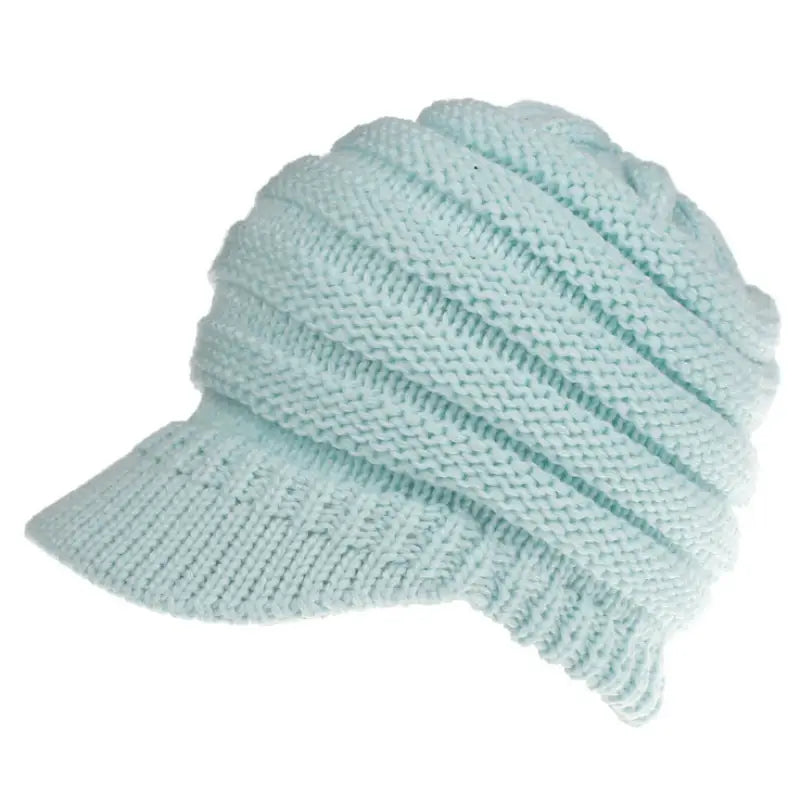a light blue knitted hat with a knot