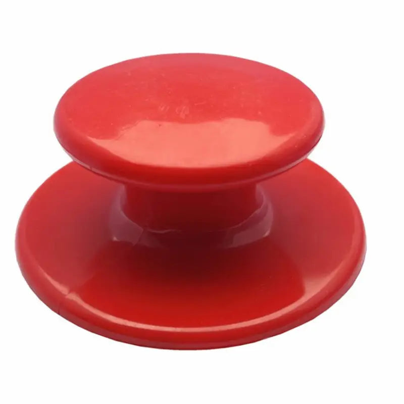 a red plastic knob with a white background