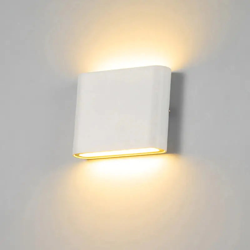 a white wall light with a white background