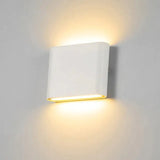 a white wall light with a white background