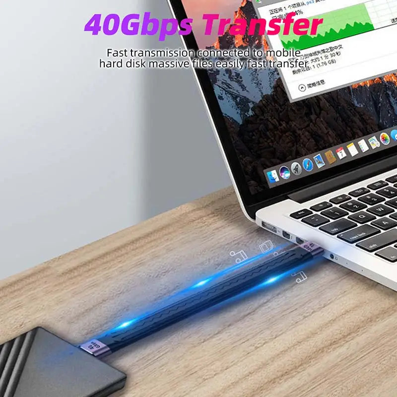 a laptop with a pen on top of it