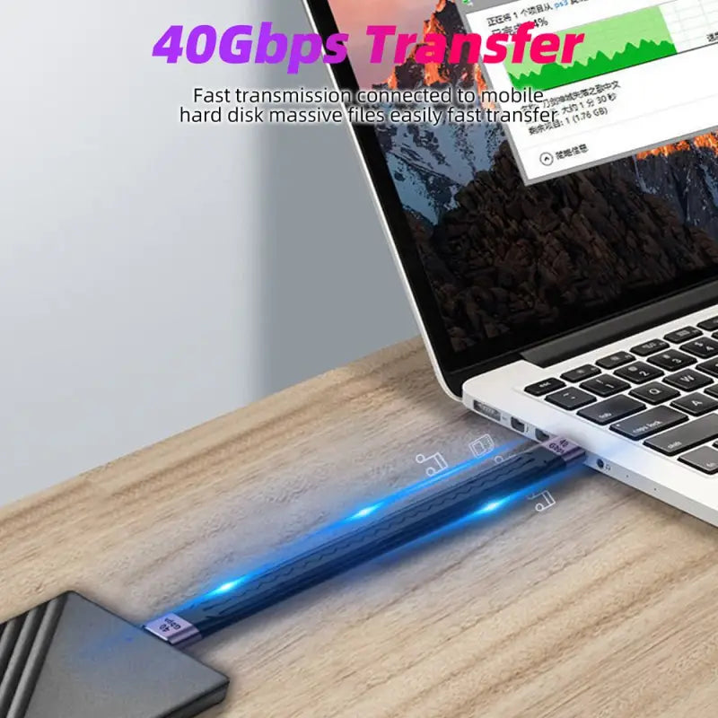 a laptop with a pen on top of it