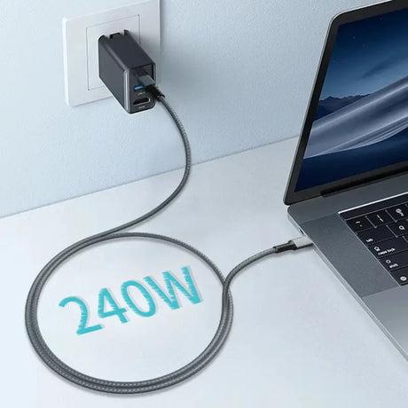 A laptop with a cable connected to it