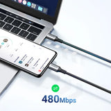 a laptop with a cable connected to it