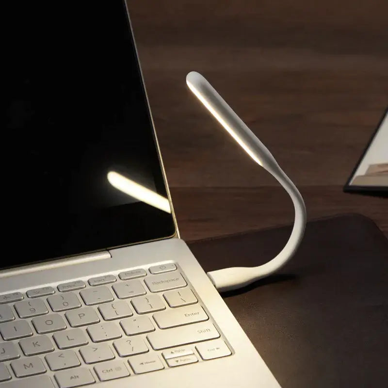 a laptop and a cell on a table