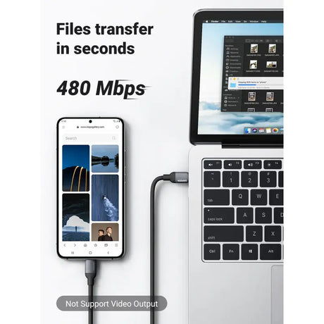 A laptop and a phone connected to a cable