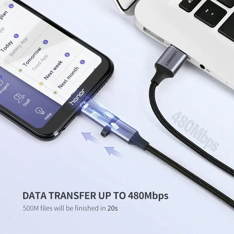 A laptop and a phone connected to a usb cable