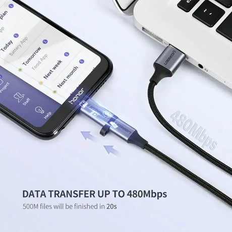 A laptop and a phone connected to a usb cable
