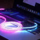 a laptop with a pink light on it