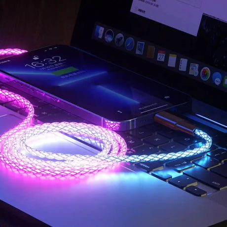 a laptop with a pink light on it