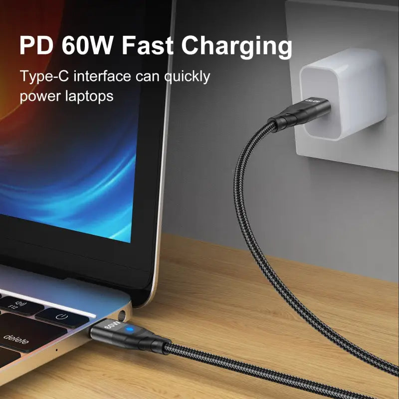 a laptop with a power cord attached to it