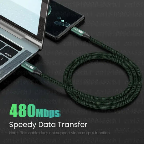 A laptop with a usb cable attached to it